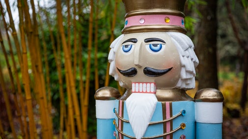 A giant blue nutcracker in the gardens at Nymans